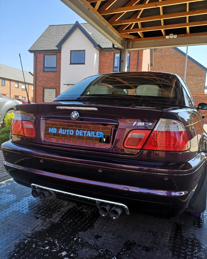 Deep purple BMW M3 gleaming after a full detail