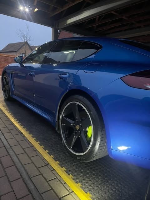 Blue Porsche Panamera with a deep gloss finish