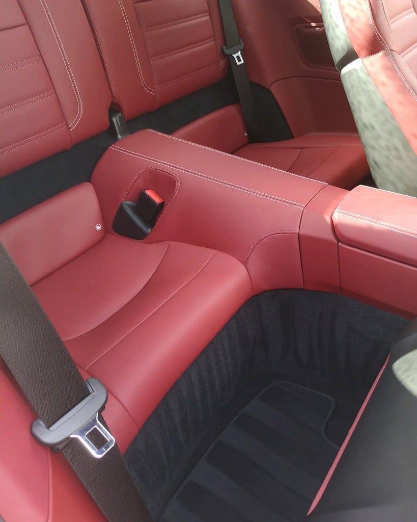 Red leather Mercedes rear seats after an interior detail