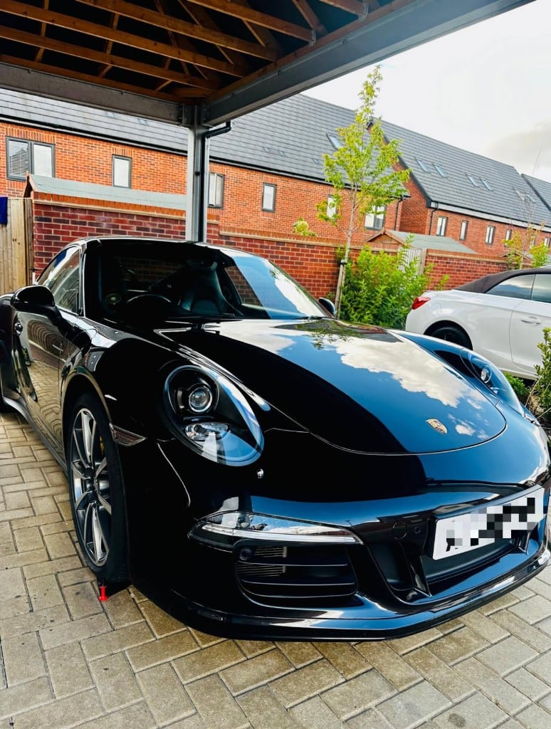 Gloss black Porsche 911 after a protection detail
