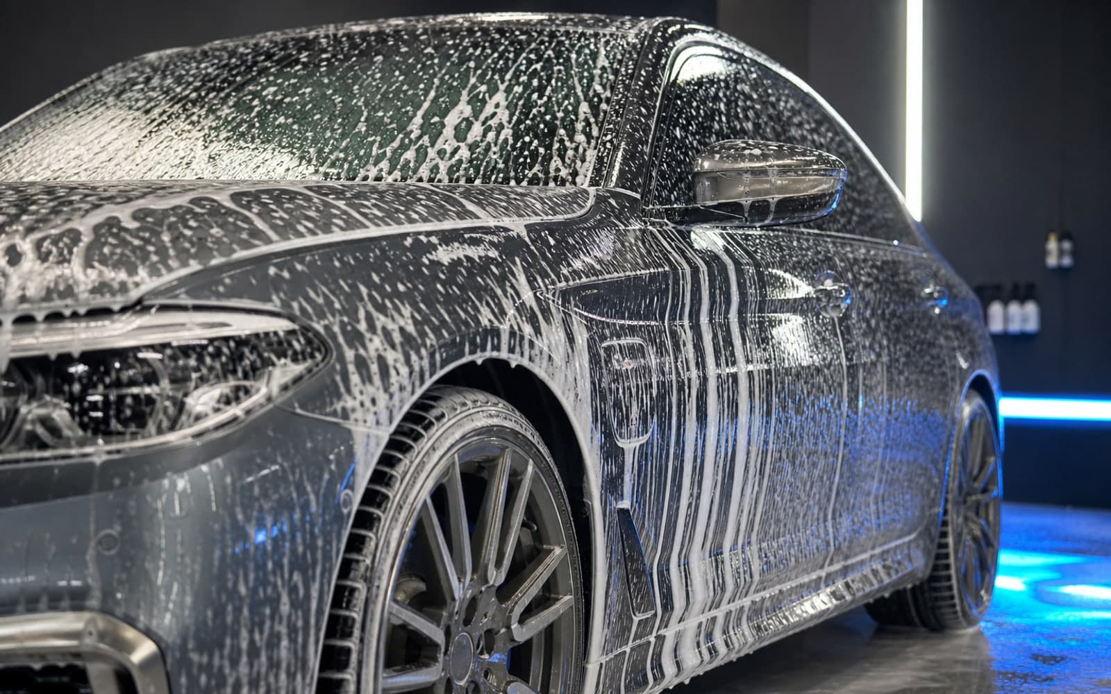 Foam-covered car during a premium valet pre-wash